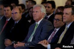 FILE - General Electric Co. Chief Executive Jeff Immelt (center) and Mexican Economy Minister Ildefonso Guajardo (second right) attend the opening of a new tower of the Global Operations Center in San Pedro Garza Garcia, neighboring Monterrey, Mexico, May 12, 2017.