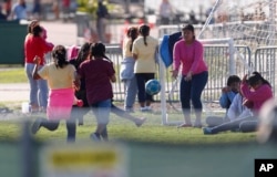 Girls play soccer at the Homestead Temporary Shelter for Unaccompanied Children in Homestead, Fla., Feb. 19, 2019.