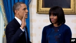 President Obama takes the oath of office at the official swearing-in ceremony in the Blue Room of the White House Jan. 20, 2013.