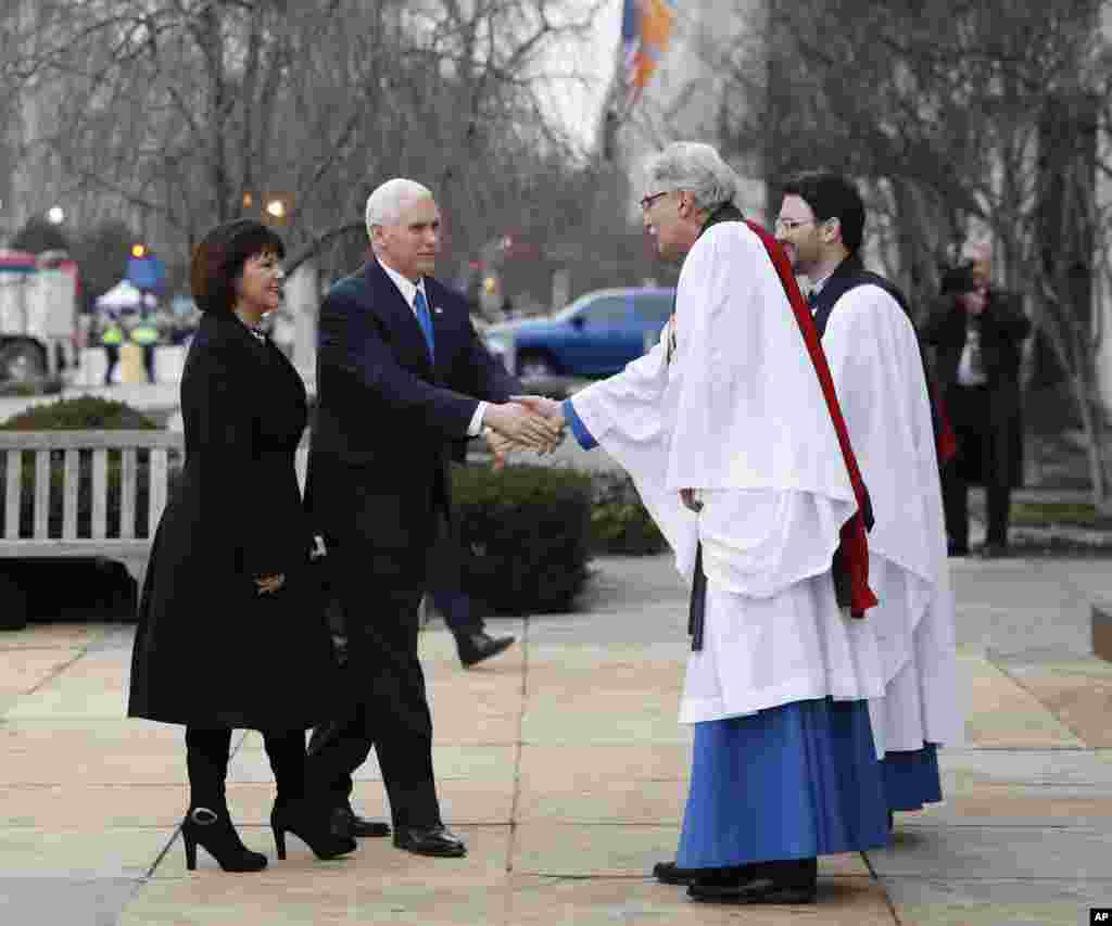 Vice President-elect Mike Pence and his wife Karen are greeted by. Rev. Luis Leon as they arrive for a church service at St. John’s Episcopal Church across from the White House in Washington, Jan. 20, 2017, on Donald Trump's inauguration day. 