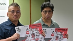 Chairperson of the Hong Kong Journalists Association Ronson Chan, left, and Chris Yeung, chief editor of the annual report, during a press conference for the release of the organization’s annual report , 'Freedom in Tatters,' in Hong Kong on July 15, 2021. 