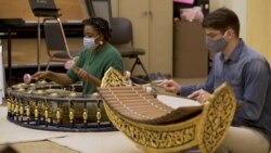 Music students Alexis Hills (L) and Michael Emnett (R) play in Thai ensemble at Kent State University, OH.