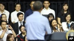 Vietnamese rapper Suboi raps as U.S. President Barack Obama listens at a town-hall style event for the Young Southeast Asian Leaders Initiative at the GEM Center in Ho Chi Minh City, Vietnam on Wednesday, May 25, 2016.