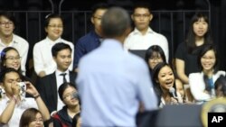 Vietnamese rapper Suboi raps as U.S. President Barack Obama listens at a town-hall style event for the Young Southeast Asian Leaders Initiative at the GEM Center in Ho Chi Minh City, Vietnam on Wednesday, May 25, 2016.