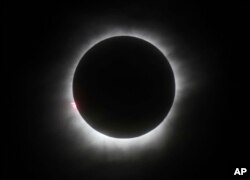 FILE - - This March 9, 2016 photo shows a total solar eclipse in Belitung, Indonesia