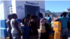 People line up to fill their receptacles with fresh water at Gonaives' brand new potable water kiosk in Haiti's north. (Photo: Exalus Mergenat / VOA Creole)