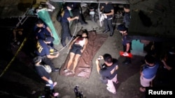 The body of a man whom police said was killed during a drug bust operation on "Shabu" (Meth), is seen in Manila, Philippines, Aug. 18, 2016.