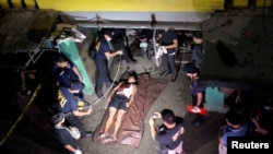 FILE - The body of a man whom police said was killed during a drug bust operation on "Shabu" (Meth), is seen in Manila, Philippines, August 18, 2016.