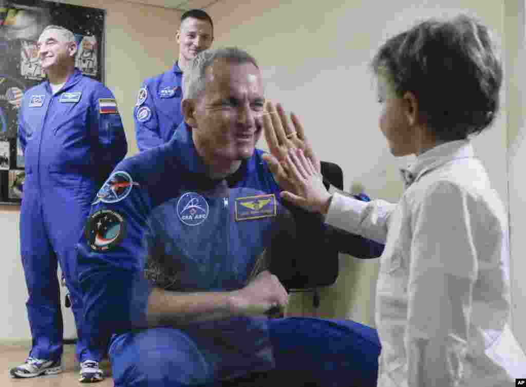 Canadian astronaut David Saint Jacques interacts with his son during a news conference in Russian-leased Baikonur cosmodrome, Kazakhstan. The new Soyuz mission to the International Space Station (ISS) is scheduled on Dec. 3, with U.S. astronaut Anne McClain, Russian cosmonaut Оleg Kononenko&lrm; and CSA astronaut David Saint Jacques.