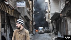 A Syrian man walks through the former rebel-held Salaheddin district in the northern Syrian city of Aleppo, Dec. 23, 2016.