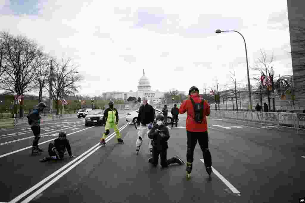 Rollerbladers roll around Washington near the Capitol as security is increased ahead of the inauguration of President-elect Joe Biden and Vice President-elect Kamala Harris in Washington, D.C.