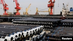Steel pipes to be exported are seen at a port in Lianyungang, Jiangsu province, China, Dec. 8, 2018.