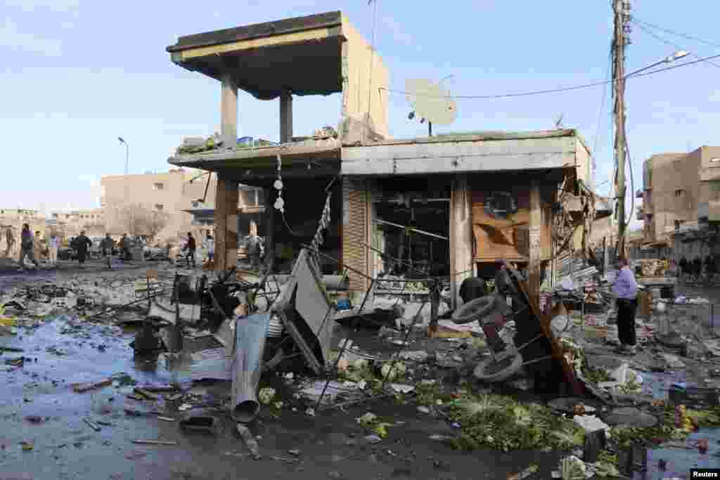 A site hit by what activists said were airstrikes by forces loyal to Syria's President Bashar al-Assad is pictured in Raqqa, Nov. 25, 2014. 