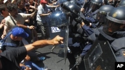 Demonstrators clash with riot police during a coal miner's march to the Spanish capital, Madrid, July 11, 2012.