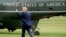 FILE - President Donald Trump walks on the South Lawn of the White House in Washington, May 8, 2019, to board Marine One.