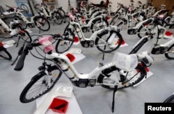 Alpha bikes, first industrialized bicycle to use a hydrogen fuel cell, are displayed at the Pragma Industries factory in Biarritz, France, Jan. 15, 2018.