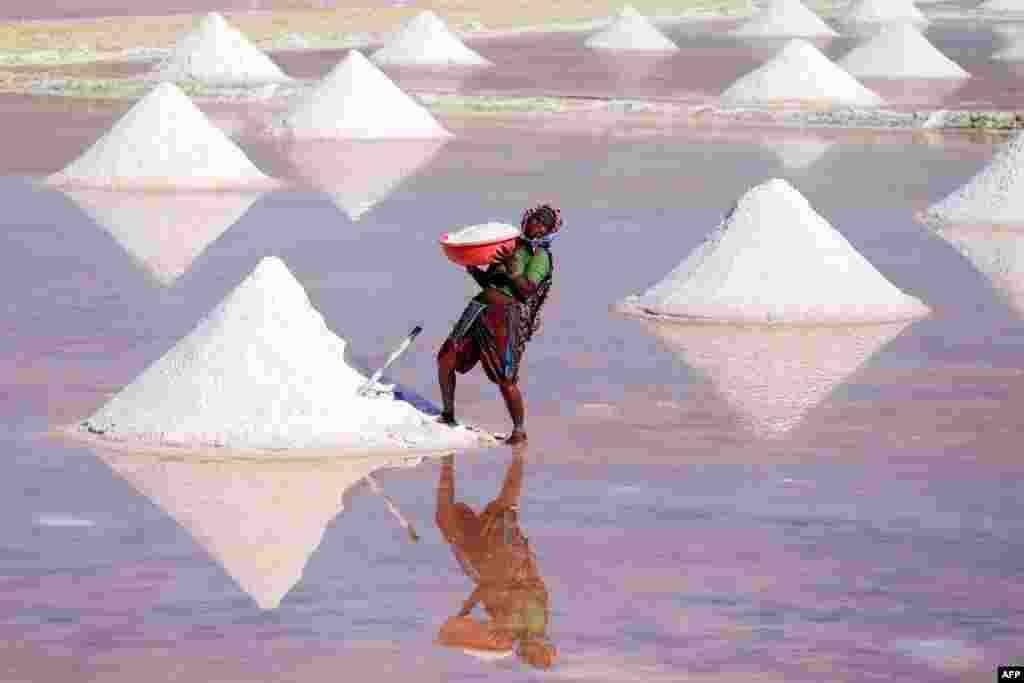 A laborer works on a salt pan on the outskirts of Nagaur district in the Indian state of Rajasthan.