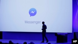  David Marcus, Facebook vice president of Messaging Products, watches a display showing new features of Messenger during the keynote address at the F8 Facebook Developer Conference in San Francisco.