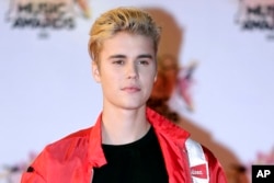 FILE - Justin Bieber arrives at the Cannes festival palace in Cannes, southeastern France.