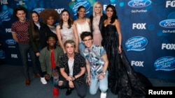 Finalists (L-R standing) Trent Harmon, Avalon Young, La'Porsha Renae, Gianna Isabella, Tristan McIntosh, Olivia Rox, Sonika Vaid, (L-R front) Lee Jean, Dalton Rapattoni and MacKenzie Bourg pose at the party for the finalists of "American Idol XV" in West Hollywood, California, Feb. 25, 2016.