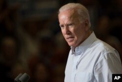 FILE - Former vice president Joe Biden speaks during a campaign event for Kentucky democratic congressional candidate Amy McGrath in Owingsville, Kentucky, Oct. 12, 2018.