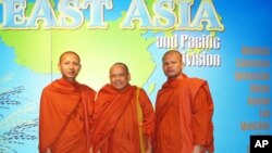 Newly re-ordained monk Tim Sakhorn, middle, drops by VOA Khmer while on a visit in the US last week. 