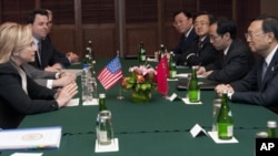 Secretary of State Hillary Rodham Clinton, left, attends a meeting with Chinese Foreign Minister Yang Jiechi, right, on the sidelines of the Association of Southeast Asian Nations Ministerial Meeting in Nusa Dua, Indonesia Friday, July 22, 2011.