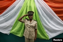 FILE - Michelle Loboue, a sub-prefect of Bouake region, poses for a photograph in Bouake, Ivory Coast, Feb. 6, 2016.