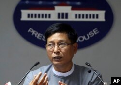 FILE - Myanmar government spokesman Zaw Htay talks to journalists during a news briefing at the Presidential Palace in Naypyitaw, Myanmar, Sept 13, 2017.