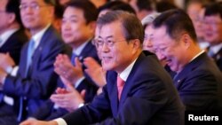 FILE - South Korean President Moon Jae-in attends a business forum in New Delhi, India, July 9, 2018. 