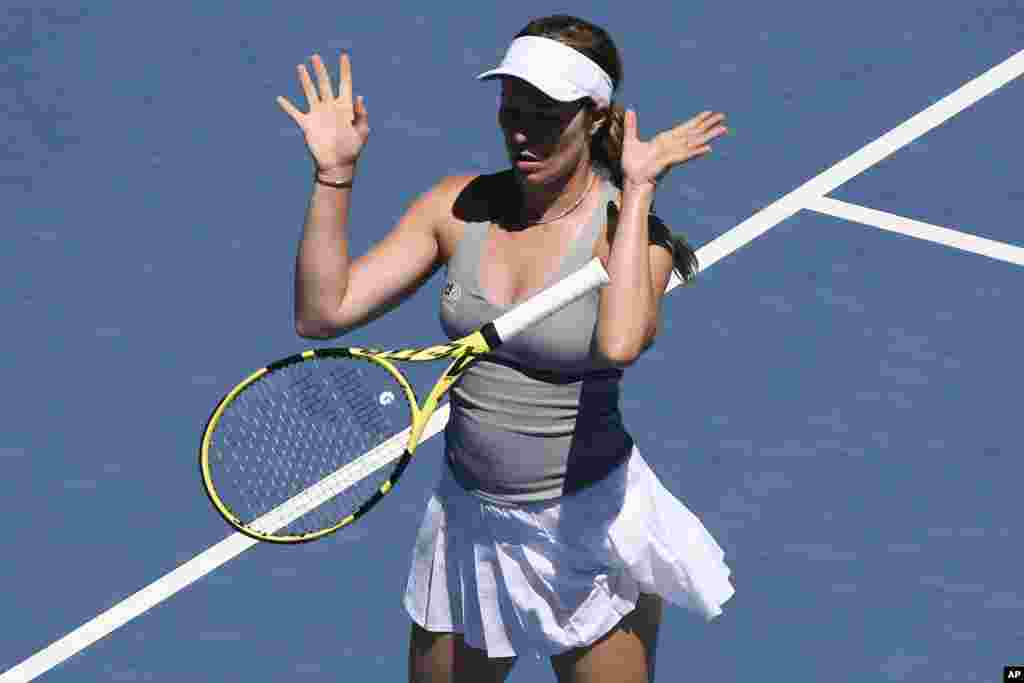 Danielle Collins of the U.S. bounces the racket in frustration during her quarterfinal match against Alize Cornet of France at the Australian Open tennis championships in Melbourne, Australia.