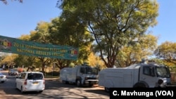 Police blocked the roads to the Zimbabwe Electoral Commission offices after protests rocked Harare, Aug. 1, 2018.