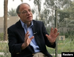 Human Rights Watch director Richard Dicker speaks during an interview in Baghdad's Green Zone, Oct. 19, 2005.