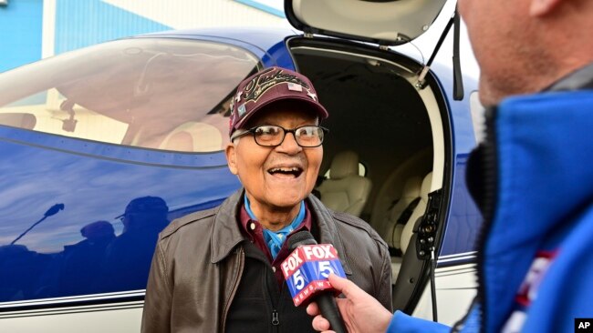 FILE - Retired Brigadier General Charles McGee, a Tuskegee Airman who flew 409 aerial fighter combat missions during three wars, is interviewed before piloting a Cirrus SF50 Vision Jet to help celebrate his 100th birthday in Frederick, Maryland, Dec. 6, 2019.