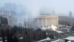 Smoke rises from the city hall building during a protest in Almaty, Kazakhstan, Jan. 5, 2022.
