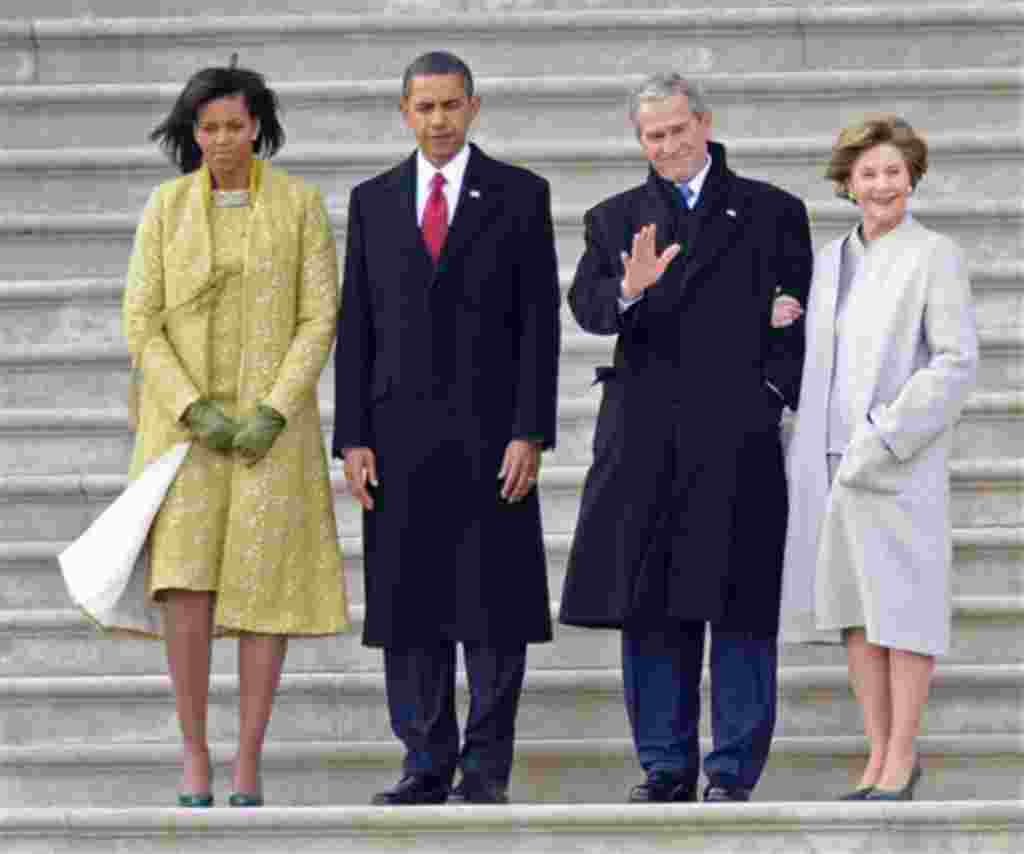Former President George W. Bush, second from right, waves as he and his wife Laura, right, stand with President Barack Obama, second from left and first lady Michelle Obama as Bush departs from the Capitol after Obama's swearing in as the 44th President o