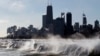 FILE - Ice forms as waves crash along the Lake Michigan shore in Chicago, Illinois, Jan. 27, 2014.