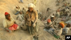 Women miners search for diamonds in eastern Zimbabwe's lucrative Marange diamond fields.