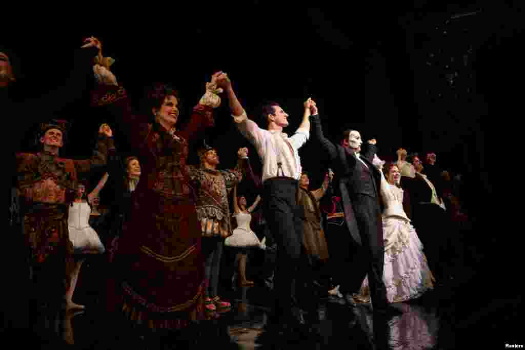 Cast members stand on the stage after performing on the re-opening night of &quot;Phantom of the Opera&quot; at the Majestic Theater in New York City, New York, Oct. 22, 2021.