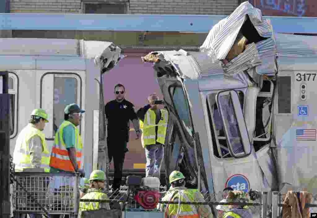 Authorities inspect the wreckage of two Chicago Transit Authority trains that crashed in Forest Park, Illinois. The CTA is investigating the cause of the crash, including why the trains were on the same track. A CTA official said 33 people suffered non-life threatening injuries.