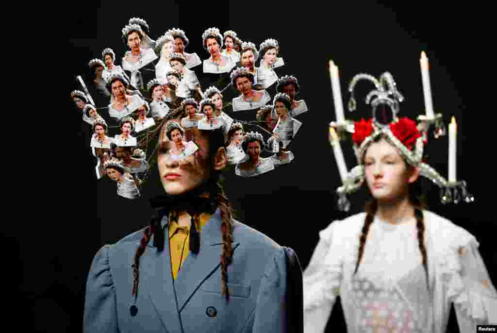 A model presents a creation adorned with images of Britain&#39;s Queen Elizabeth II at London Fashion Week Women&#39;s A/W19.