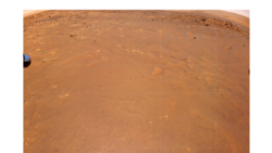 NASA’s Ingenuity Mars Helicopter took this color image during its fourth flight, on April 30, 2021. “Airfield B,” its new landing site, can be seen below. The helicopter will seek to set down there on its fifth flight attempt. (NASA/JPL-Caltech)
