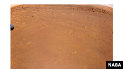 NASA’s Ingenuity Mars Helicopter took this color image during its fourth flight, on April 30, 2021. “Airfield B,” its new landing site, can be seen below. The helicopter will seek to set down there on its fifth flight attempt. (NASA/JPL-Caltech)