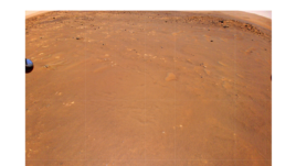 NASA’s Ingenuity Mars Helicopter took this color image during its fourth flight, on April 30, 2021. “Airfield B,” its new landing site, can be seen below. The helicopter will seek to set down there on its fifth flight attempt. (NASA/JPL-Caltech)