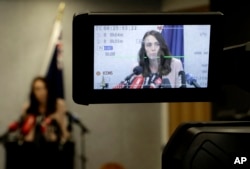New Zealand Prime Minister Jacinda Ardern is seen on a TV camera's LCD screen as she addresses a press conference in Christchurch, New Zealand, Friday, March 13, 2020.
