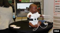 A display at the annual event organized by Saving Lives at Birth, July 28, 2016. (S. Solomon/VOA)