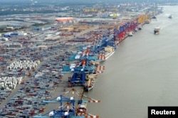 FILE - Shipping terminals and containers are pictured in the harbour of the northern German of Bremerhaven on the banks of the river Elbe, Oct. 8, 2012.