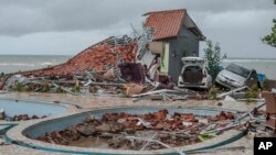 Debris littered a property badly damaged by a tsunami in Carita, Indonesia, Dec. 23, 2018. 