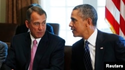 Speaker of the House John Boehner (R-OH) left, talks to U.S. President Barack Obama during a meeting with bipartisan Congressional leaders, Sept. 3, 2013.