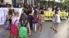 Students enter Luis Vives secondary school as teachers protest cuts in public education in Valencia, Spain, September 14, 2012. 